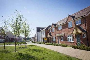 Front of a row of housing opposite green